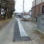 ５年目になる地元・横町町内会の１０メートルにわたるU字溝敷設工事(写真下のアスファルトが黒い部分の右側、フタ掛けしてある側溝部分）が完了しました。